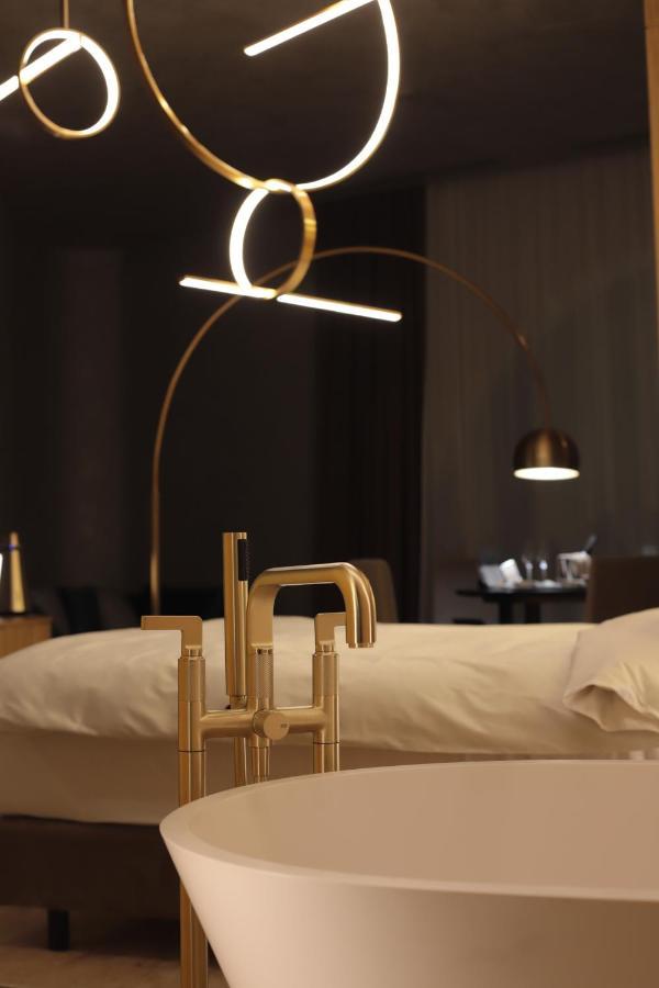 The Veil Hotel Akmola Esterno foto A floor lamp